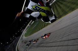 Kyle Busch takes the checkered flag as it is displayed under caution to win the NASCAR Nationwide Series Dollar General 300 Powered by Coca-Cola at the Chicagoland Speedway on Friday night. Credit: Todd Warshaw/Getty Images for NASCAR